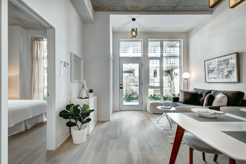 Bright living room with wooden floors and white décor