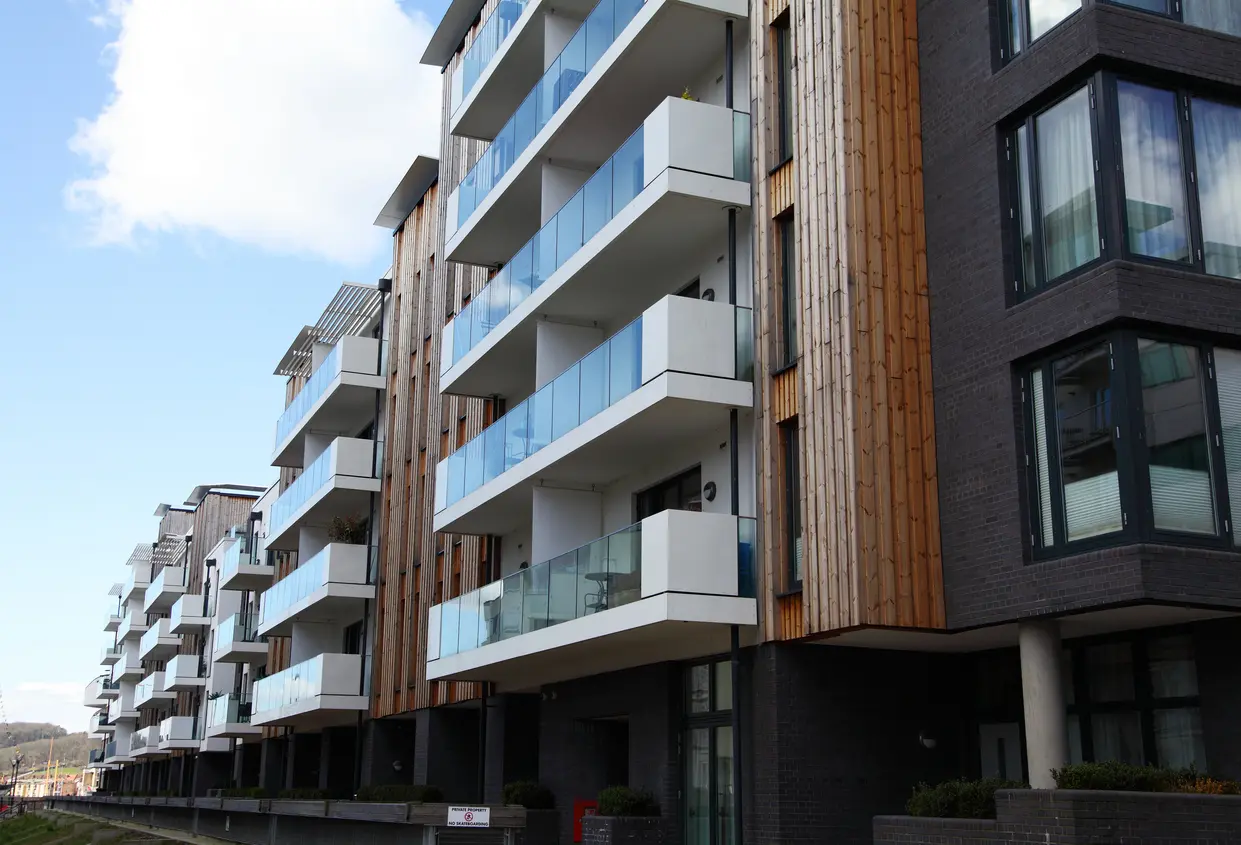 A modern apartment block with balconies on the Bristol harbourside