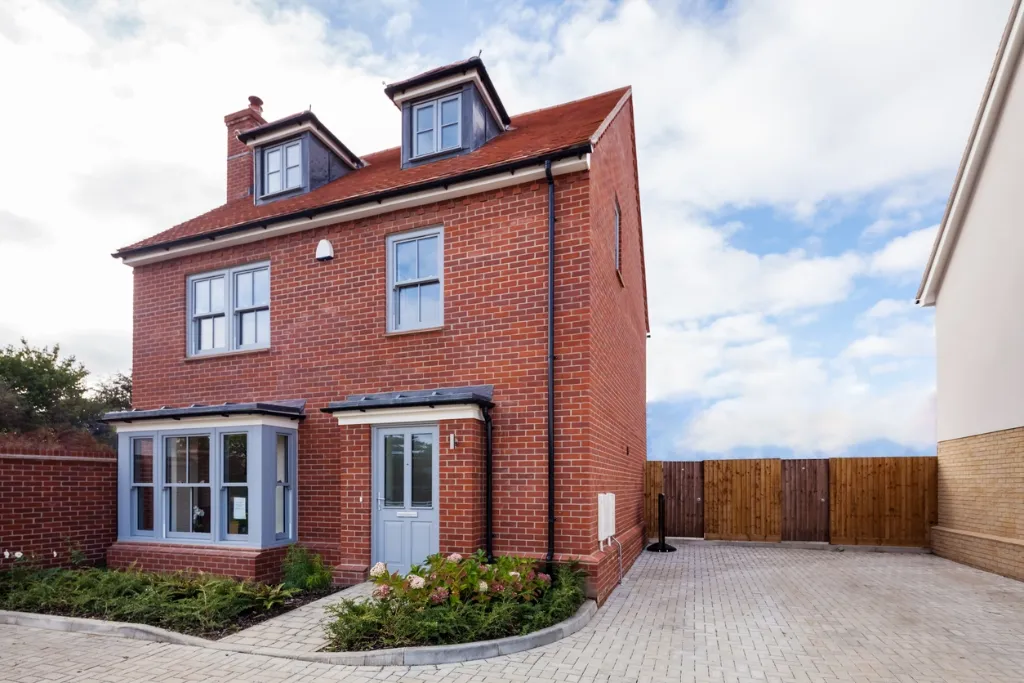 New build detached house in Bristol with red brick construction for property investment opportunities