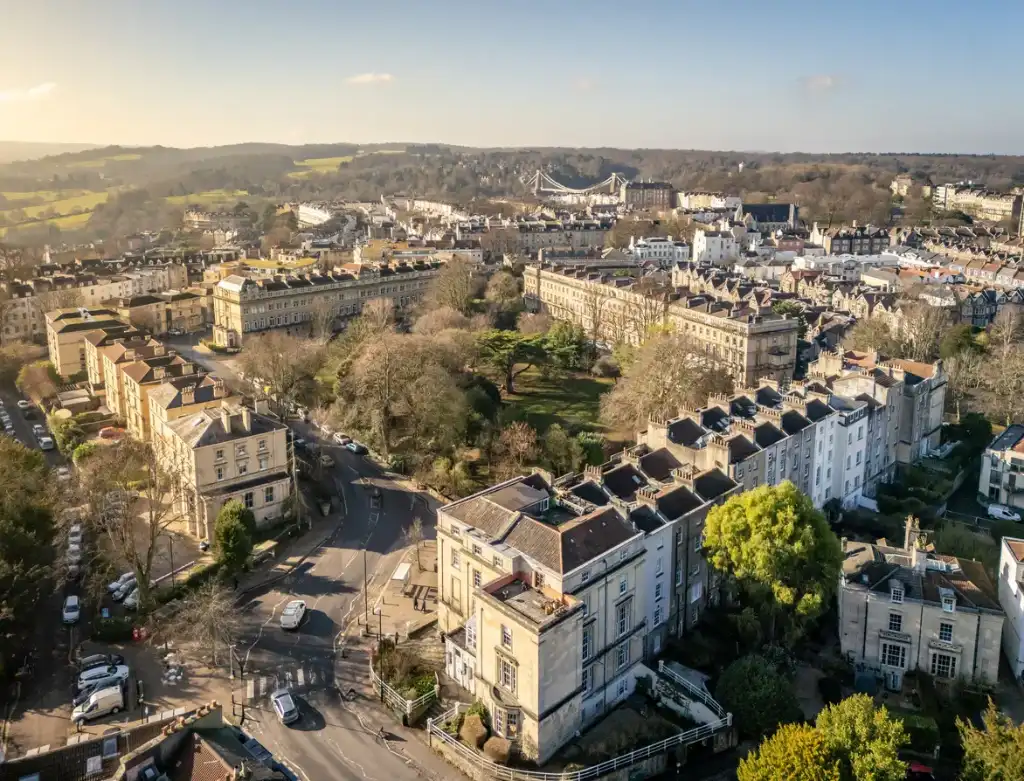 Aerial view of Clifton Bristol showing Georgian terraces and Clifton Suspension Bridge for luxury property investment