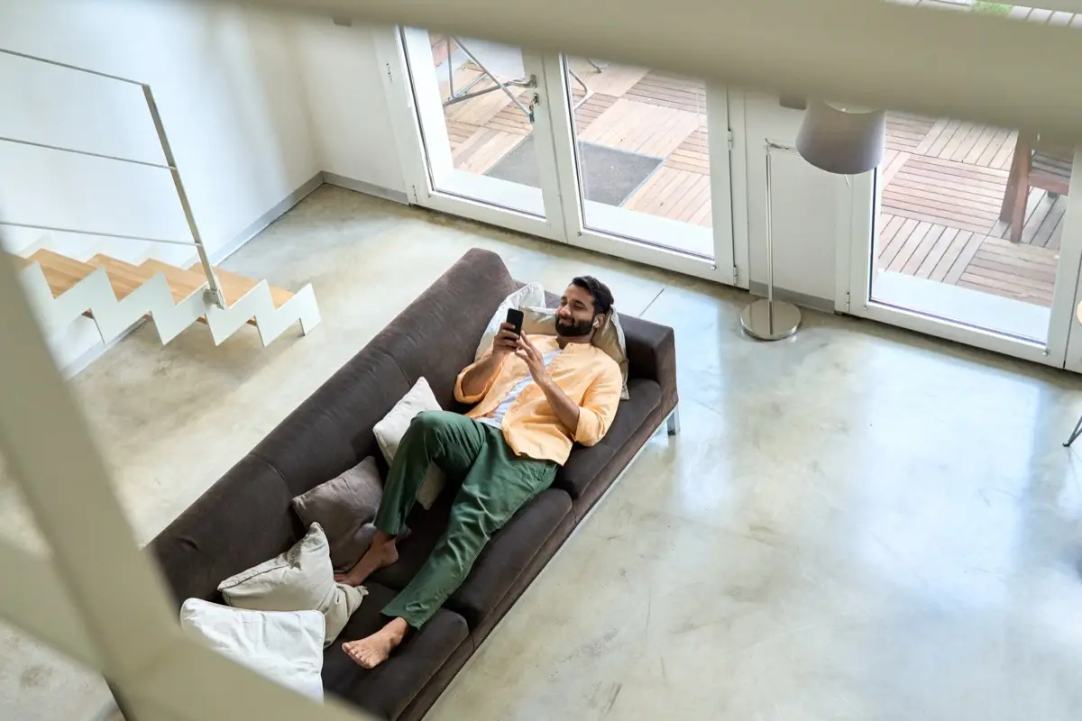 A property owner relaxing at home while his holiday let is managed for him