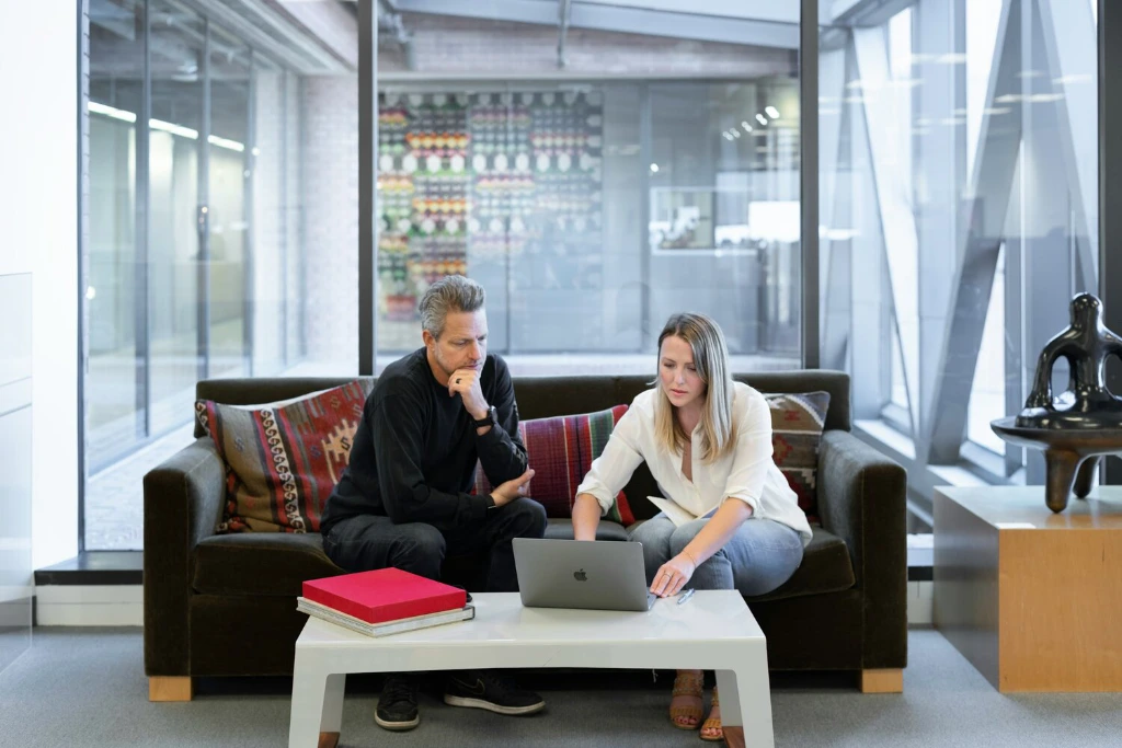 Man and woman part of a property management team discussing their next strategy