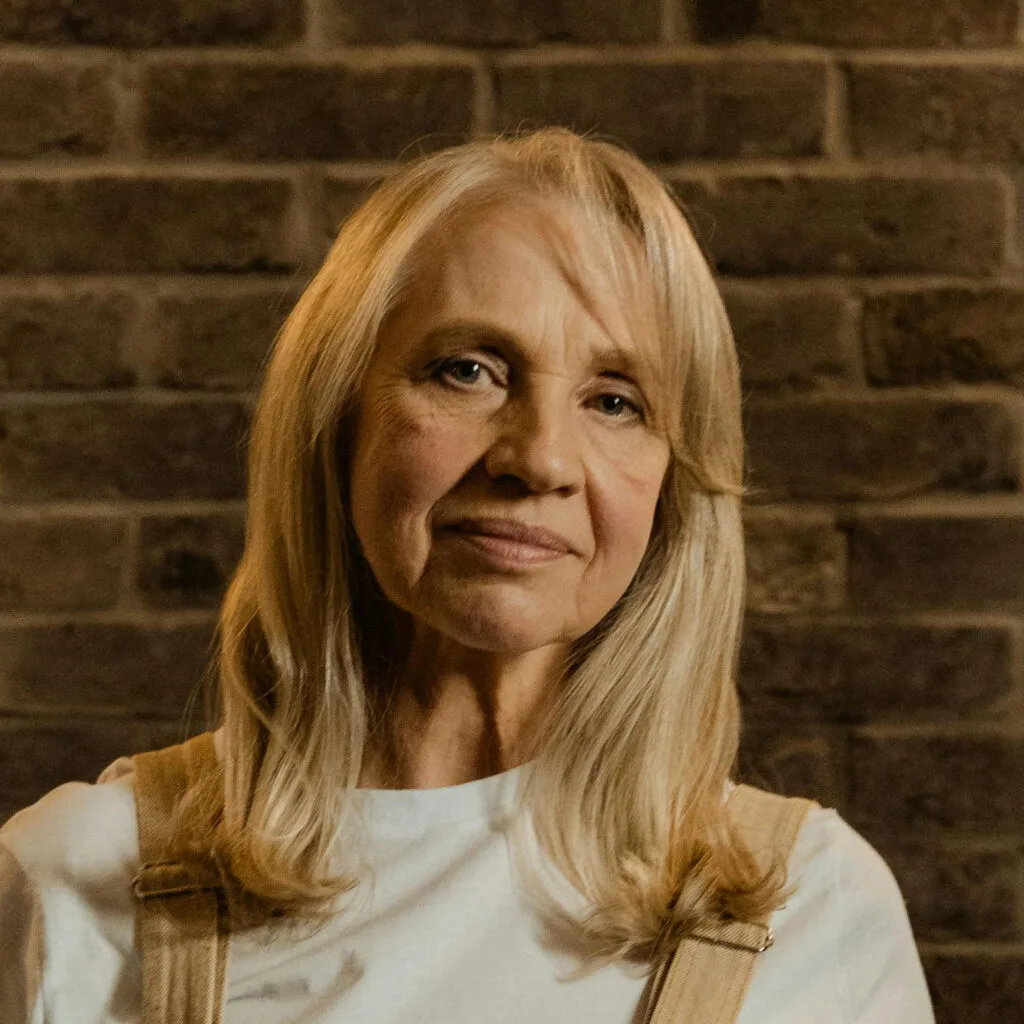Portrait of woman with long blonde hair in soft lighting