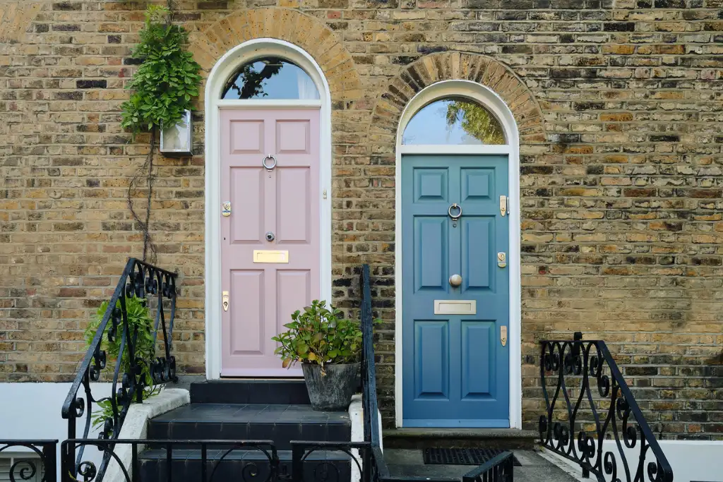 Pastel coloured front doors on a period brick terrace
