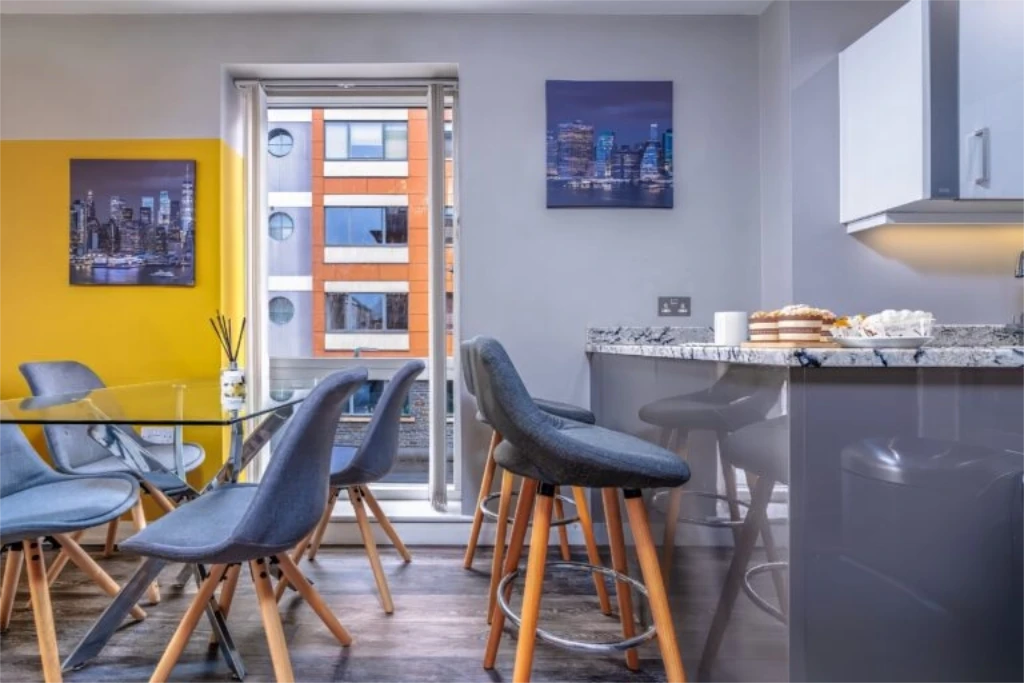 Integrated dining and kitchen space showing seamless design in Lorna's Upgraded Property Management rental
