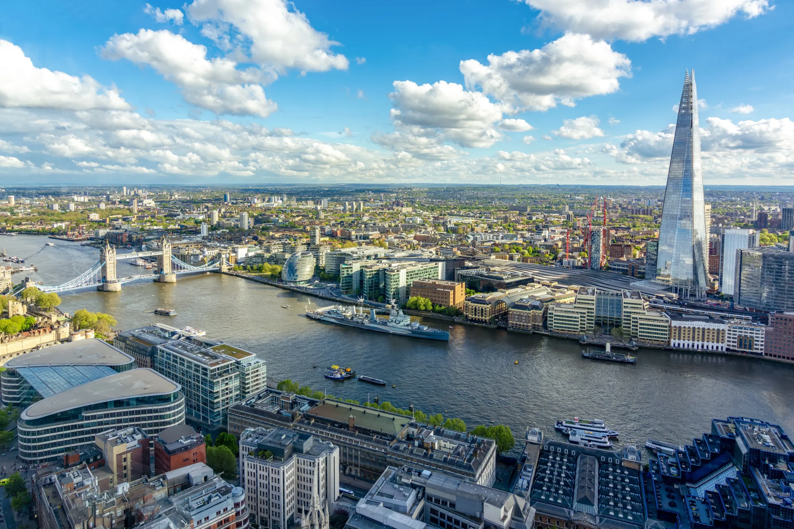 An aerial view over South London with the Shard and Tower Bridge