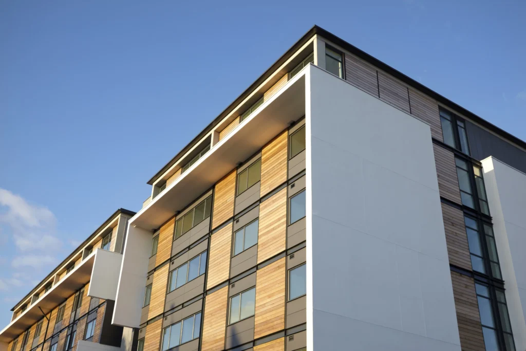 Contemporary flats with wood cladding and large windows