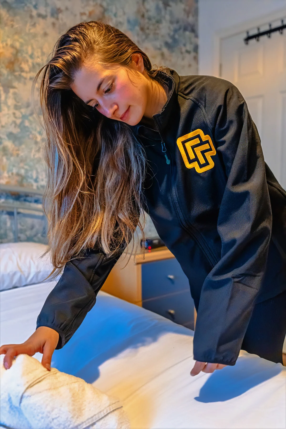 A member of the UpgradedPM property care team working in a managed bedroom