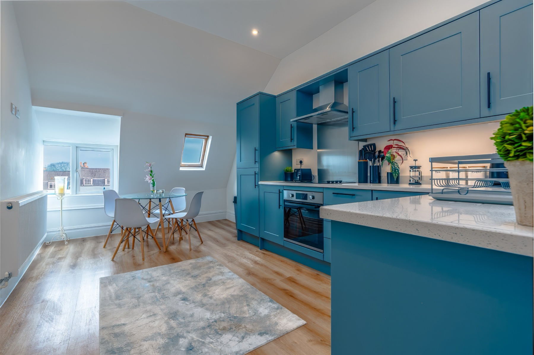 Blue kitchen in a representative apartment from UpgradedPM’s Bristol managed collection